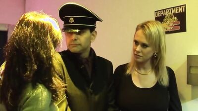 Captured criminal breaks free to pound the blonde and brunette milfs in doggy style during a threesome