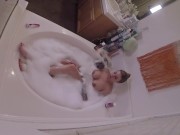 Stacked MILF masturbating in bathtub