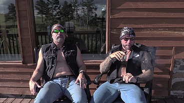 Two bikers in the mountains with Jim Love and Jason Collins