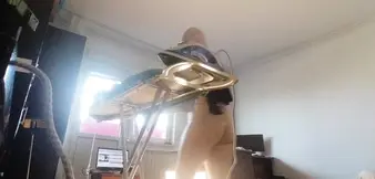 Sexy woman doing naked housework. Brunette, hairy pussy, big ass, big tits. Sexy mom massages herself with a vibrator.