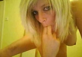 Busty white blondie fingering her holes in front of webcam