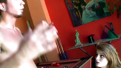 Faye Reagan takes charge on a red pool table in a vibrant game room