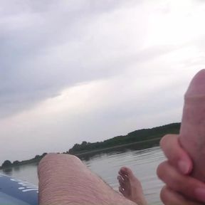 My wife jerks my cock with a happy ending in the inflatable boat on the lake