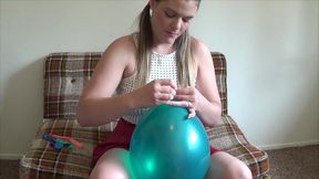 Kendra blows up her Balloons