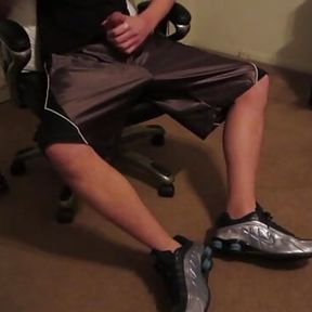 College guy sniffs his musky sneakers making him cum on his dazzle shorts.