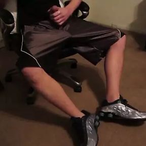 College guy sniffs his musky sneakers making him cum on his dazzle shorts.