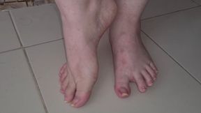 Big feet walking barefoot slowly