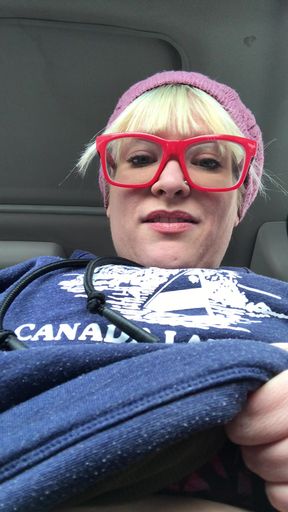 BBW In glasses shows off her big tits as she sits in traffic in the car