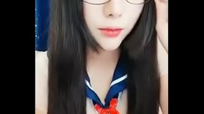 Japanese babe rubs her clit and plays with her wet hole