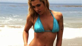 Gorgeous porn model in bikini Bailey Blue is fucking herself on the beach