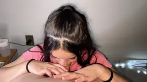 Naughty brunette with hard tits showing on her shirt giving a deep blowjob on a big pink dick