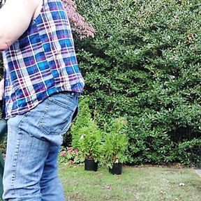 Gardener dad moving plants, then takes a break for a smoke