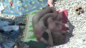 Beach Voyeur. Mature couple fucking under the shining sun