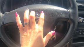 nails tapping on steer wheel