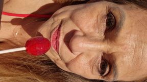 Melissa Johnson Sucks and Licks a Cherry Lollipop on the.beach