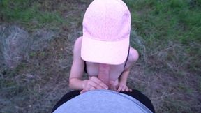 Young woman enjoys outdoor encounter in the fields, almost caught during intense action.
