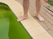 Wanking outside next to swimming pool