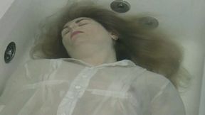 You are face up in bathtub where you try to go underwater and release a little air MP4 HD 720p