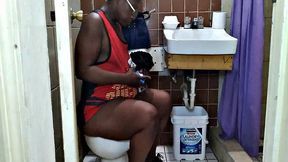 Watch this American MILF with black hair get down and dirty in the toilet
