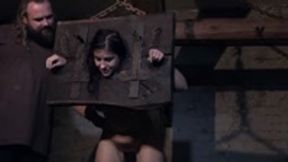 The acccused stable maid gets punished at the medieval pillory