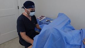 Doctor Nick wears surgical PPE and performs exam on his female patient