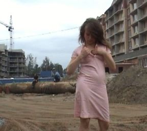 Fabulous Russian teen in pink dress flashes her goodies at the construction site