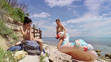 Lesbian inflatable domination on the beach