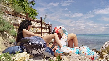Lesbian inflatable domination on the beach