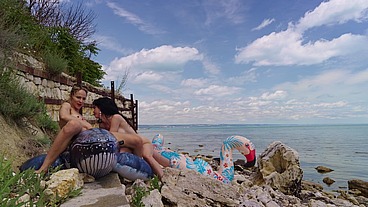 Lesbian inflatable domination on the beach