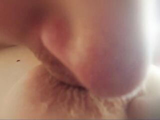 kissing aged mom's wrinkled teat close-up