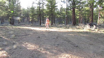 Naked walk on a dirt road.