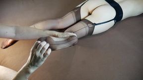 Sexy woman in long nylon socks gets her feet tickled and massaged