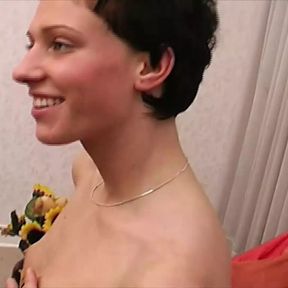 A slim German babe gets her small boobs sprayed with cum