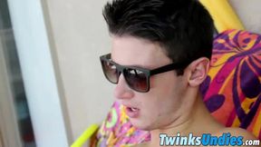 Twink Damon Archer is jacking his dick off with shades on