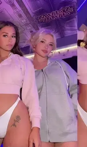 Unzipping our hoodies to display you our swimsuits