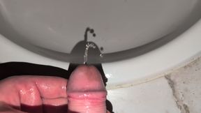Old man with small limp cock pissing in the sink.