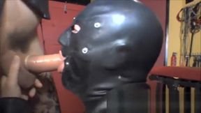 Horny crossdresser Zoe gives latex gimps her full 9 inches of cock