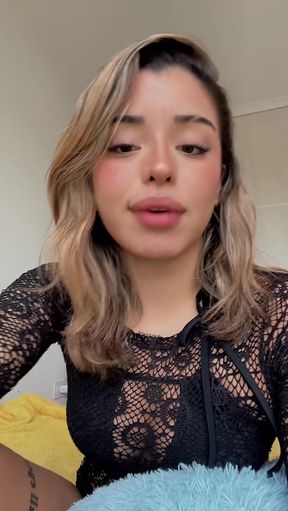 Blonde woman with braces in a black top