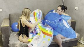Rosy and Alina blowing by mouth inflatable whale and inflatable unicorn