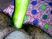 Inserting huge cucumber in asshole