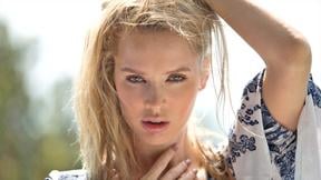 Two petite MILF babes both give an outdoor striptease for Playboy