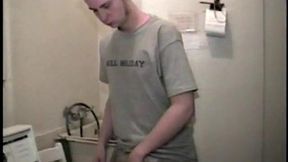 Boy-next-door spreads his new straight porn magazine on top of the washing machine and pulls his cock out of the fly.