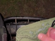 Cumming in park on bike and short
