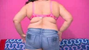 Webcam solo with a dressed fat brunette rubbing her clit with a dildo