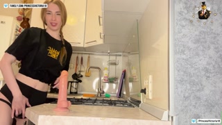 Hot masturbation of a tight pussy on the kitchen table from a redhead beauty