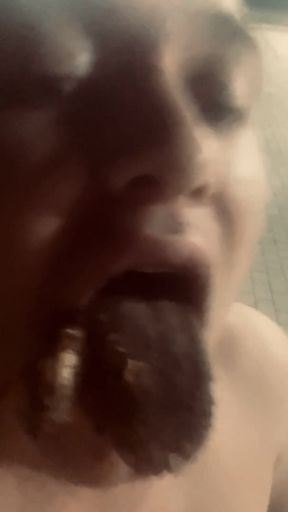 Eats Cigarette Butts and Trash From a Trash Can on the Street
