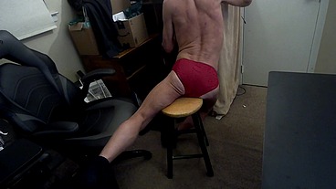Grinding Stretch on Stool in red briefs for Pelvic Pain Relief and Myofascial Integration with Bulge and Butt and Chest and Belly