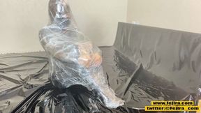 Sexy submissive girl wrapped tight in plastic film for intense sweaty bondage orgasm&#x1F4A6;.