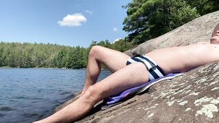 AarontheKayaker's Canadian dude rubs his tight foreskin on the beach in his swim trunks