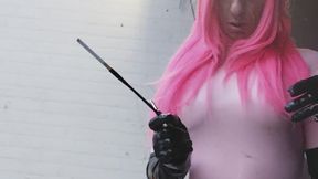 Smoking outside in pink catsuit